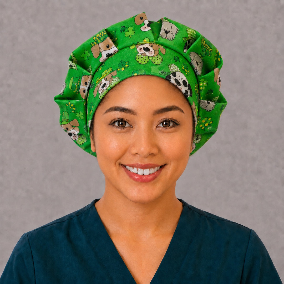 Woman wearing a St. Patrick's Day dog bouffant scrub cap, front view — puppies in leprechaun hats with glitter shamrocks on green, adjustable women's surgical hat