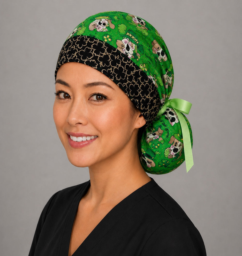 St. Patrick's dogs ponytail nurse cap left three-quarter angle on smiling model showing dogs in leprechaun hats and clovers with black clover band and lime green ribbon bow