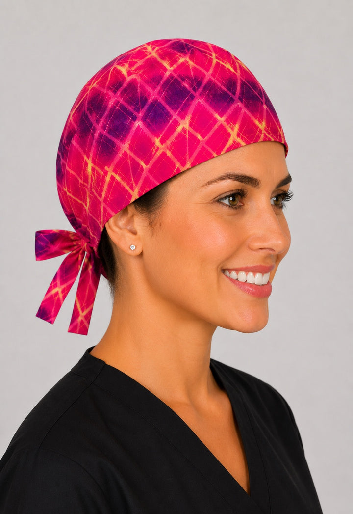 Starlight tie dye scrub cap for short hair, handmade pink and purple tie-back surgical hat on OR nurse, front view