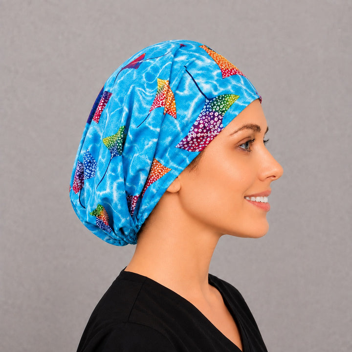 Right side profile of the stingray Euro surgical hat — rippling blue water print, breathable cotton cap for OR nurses