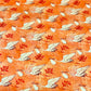 Close-up of coral stork and crane fabric print for L&D ponytail scrub cap, white storks carrying baby bundles, OR World