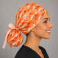 Profile view of coral stork ponytail scrub cap with peach ribbon ties for women with long hair, labor and delivery surgical hat, handmade USA, OR World