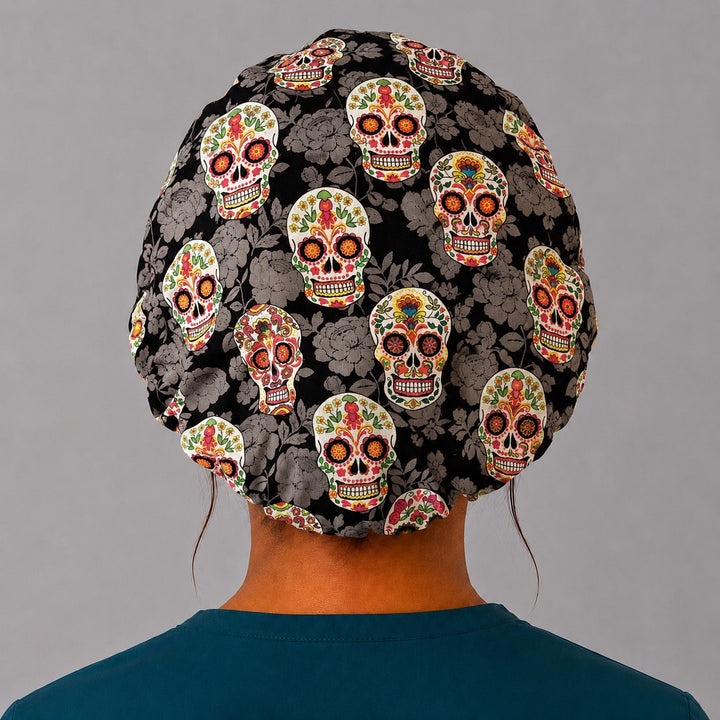 Sugar skull bouffant scrub cap back view showing full Day of the Dead floral skull print on black tonal-floral, OR World surgical hat
