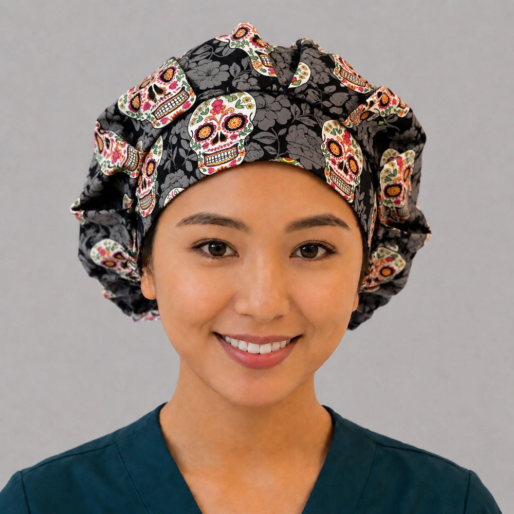 Sugar skull bouffant scrub cap for women, front view, colorful Day of the Dead floral skulls on black tonal-floral, handmade Halloween nurse hat by OR World