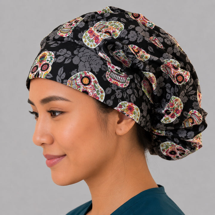 Sugar skull bouffant scrub cap left side profile showing colorful floral sugar skulls on black tonal-floral, women&