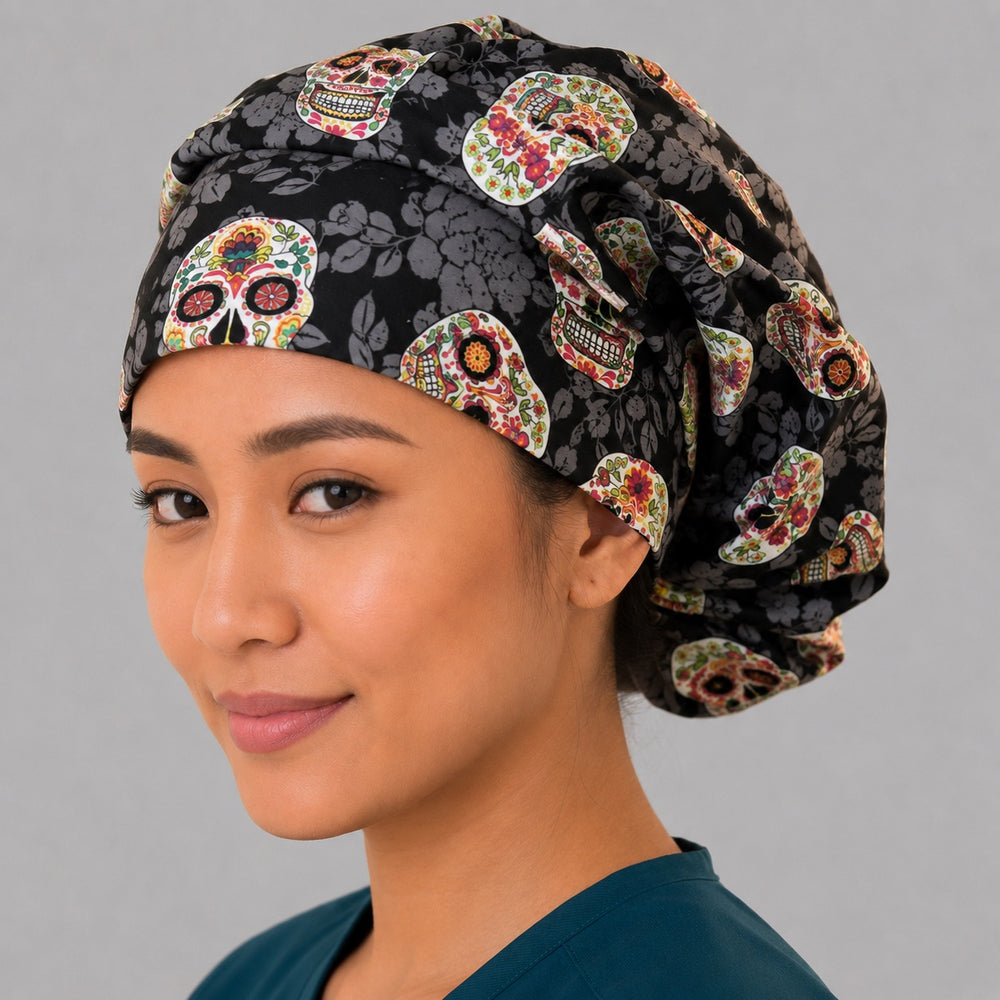 Sugar skull bouffant scrub cap left three-quarter angle on smiling model, Day of the Dead floral skulls on black, women's surgical hat OR World
