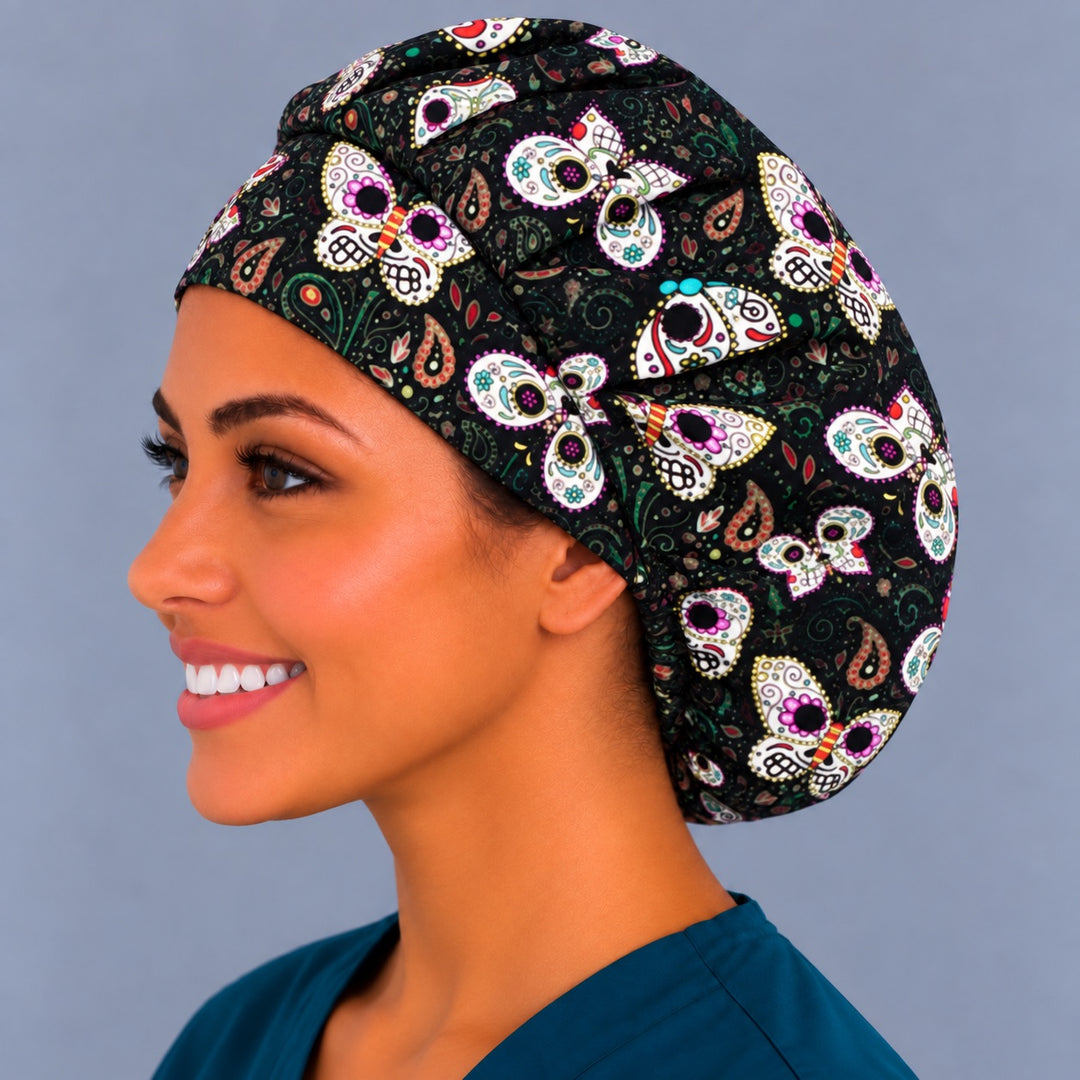 Back view of the Sugar Skull Butterfly bouffant scrub cap — gathered crown showing skull butterflies and paisley across the black fabric