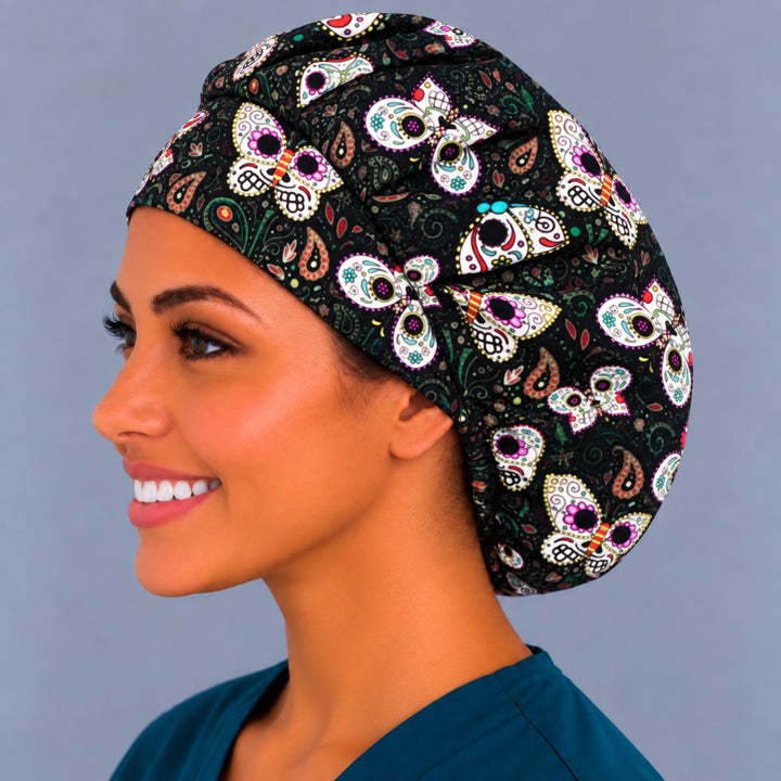 Back view of the Sugar Skull Butterfly bouffant scrub cap — gathered crown showing skull butterflies and paisley across the black fabric