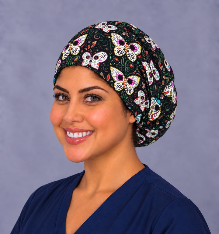 Right side profile of the sugar skull butterfly Euro scrub cap, smiling view — teal and paisley detail
