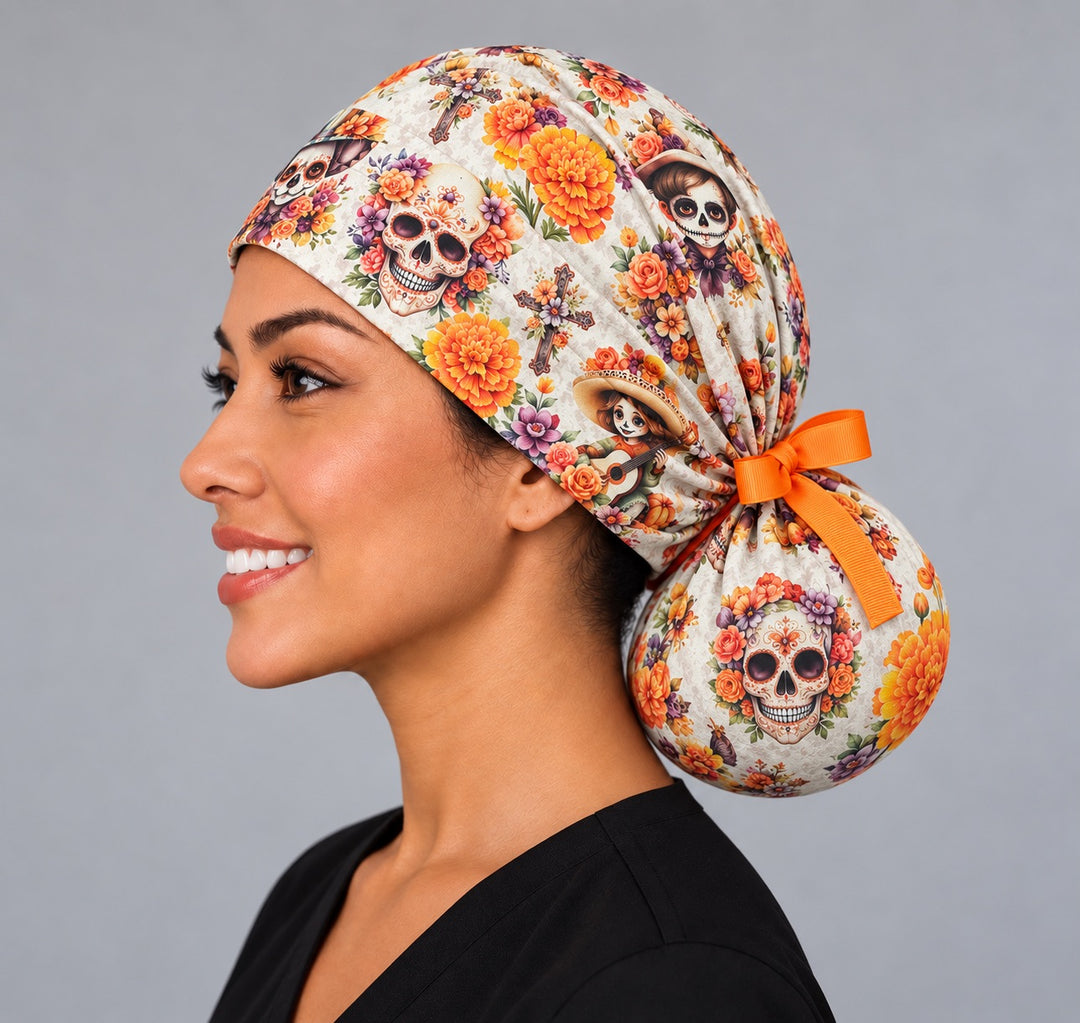 Left profile of the sugar skull marigold ponytail nurse cap, flat front band and full gathered pouch for thick or curly hair, women-owned OR World