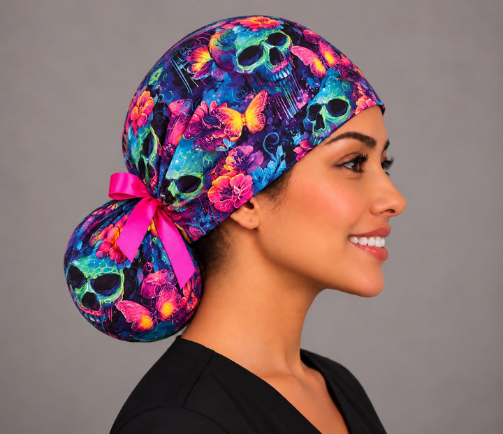 Right profile of the sugar skull ponytail surgical hat with pink grosgrain bow, handmade in USA for OR nurses