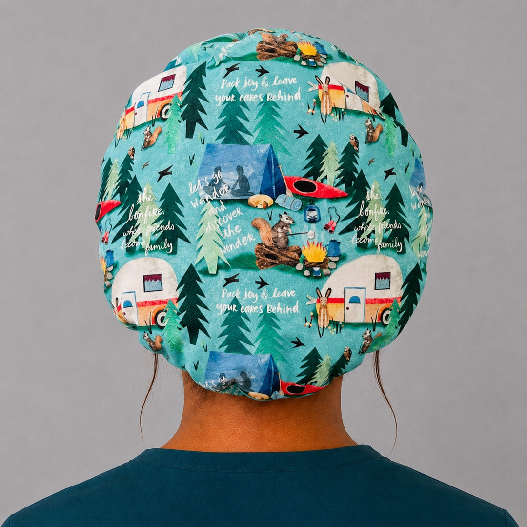Summer camping bouffant scrub cap back view showing full teal woodland print with campers, tents, kayaks, pine trees and camping sayings, OR World surgical hat
