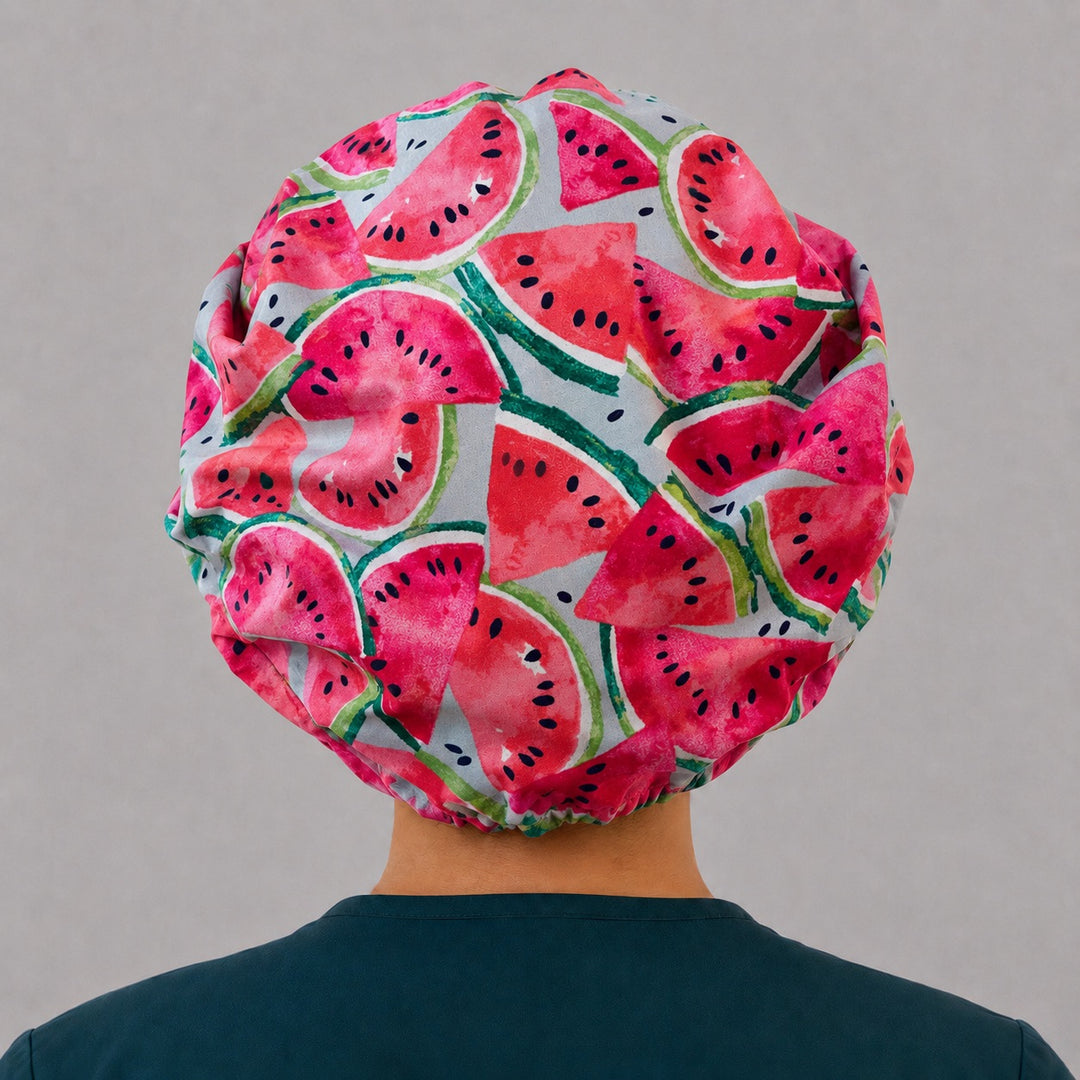Summer watermelon bouffant scrub cap on a smiling nurse, front view — bright fruit print bouffant hat for OR and surgical teams
