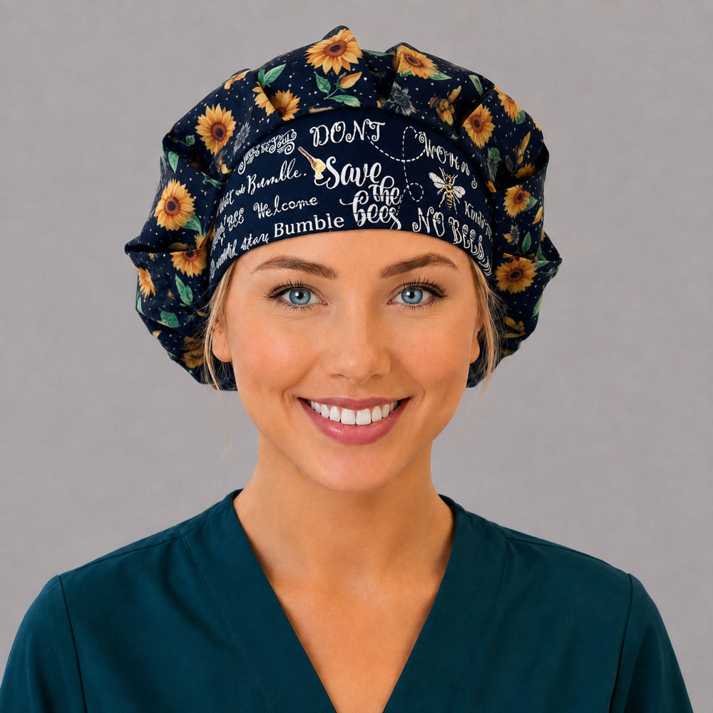Woman wearing a sunflower bee bouffant scrub cap, front view — black sunflower print with Save the Bees lettered band, adjustable women's surgical hat