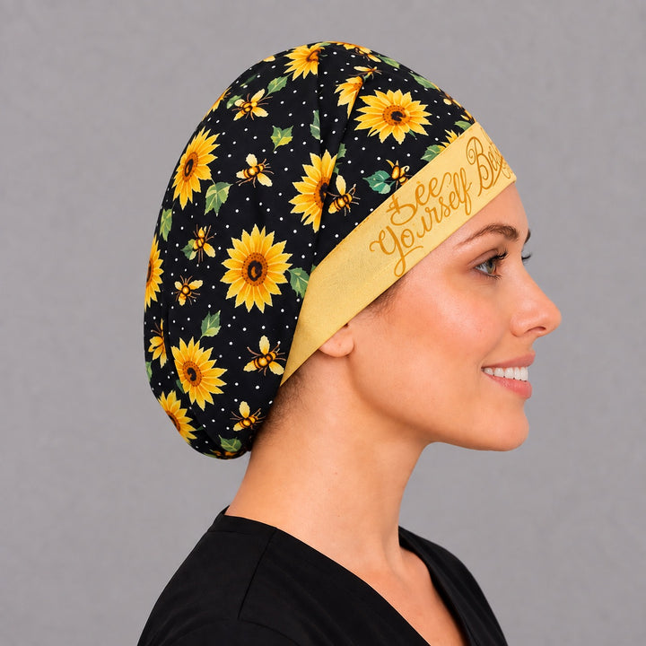 Sunflower honeybee Euro cap, left side profile — navy floral print, breathable cotton cap for OR nurses