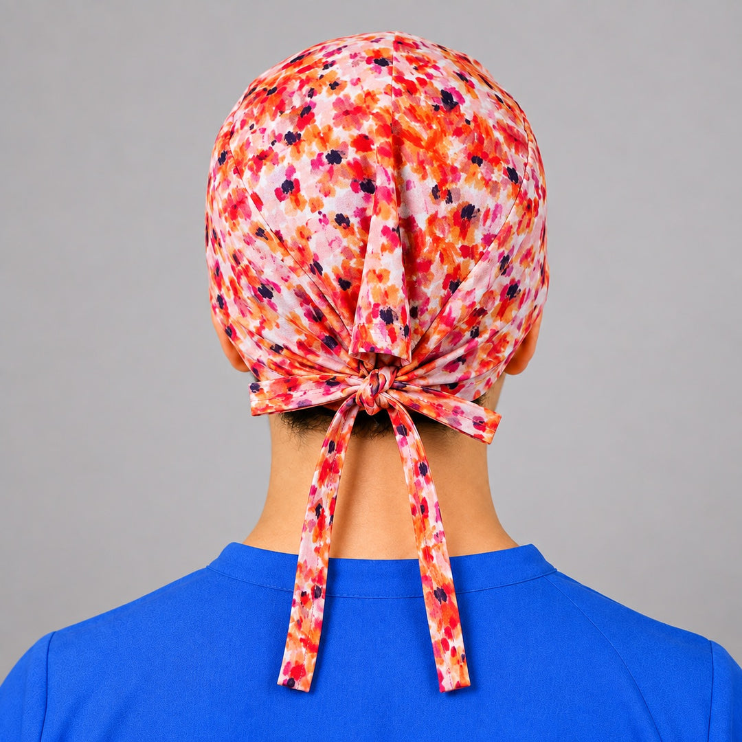 Rear tie knot with long tails on sunset speckle scrub cap, adjustable OR hat for vet techs and surgeons