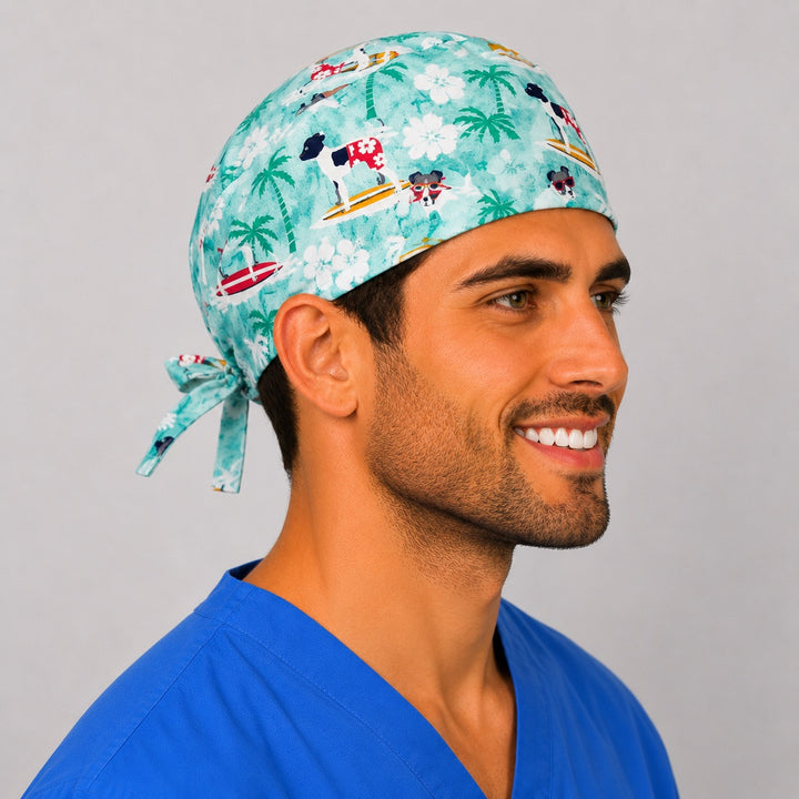 Surfing dogs summer scrub cap angled view — tropical beach veterinarian cap with adjustable tie-back, great gift for vet clinics