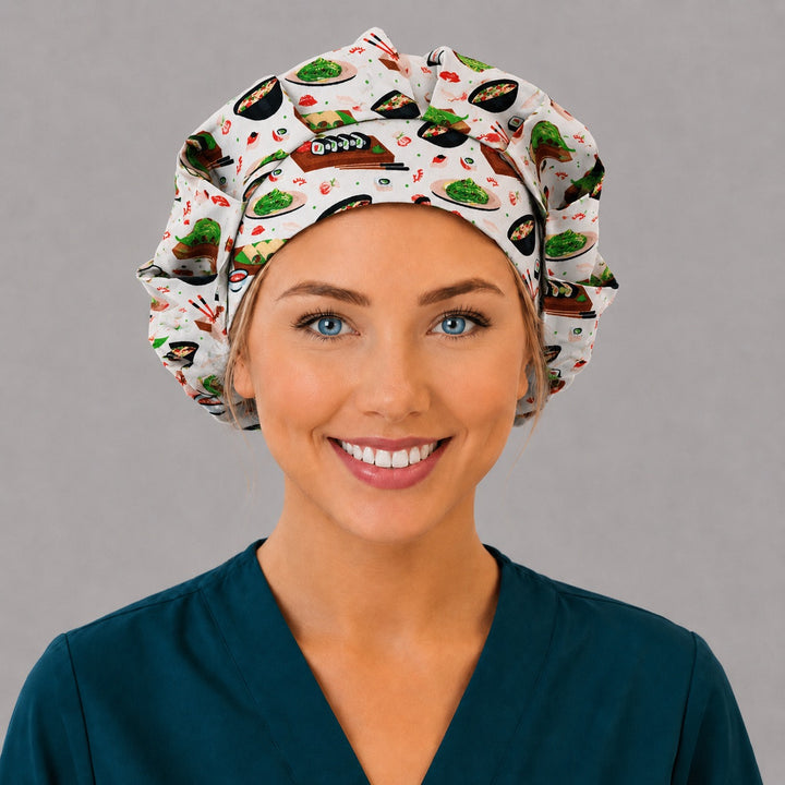 Woman wearing a sushi bouffant scrub cap, front view — Japanese food print with maki rolls and ramen bowls, adjustable women&