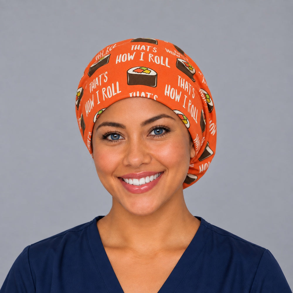 Woman wearing a funny sushi Euro scrub cap, front view — That's How I Roll maki print on orange, adjustable surgical hat for nurses