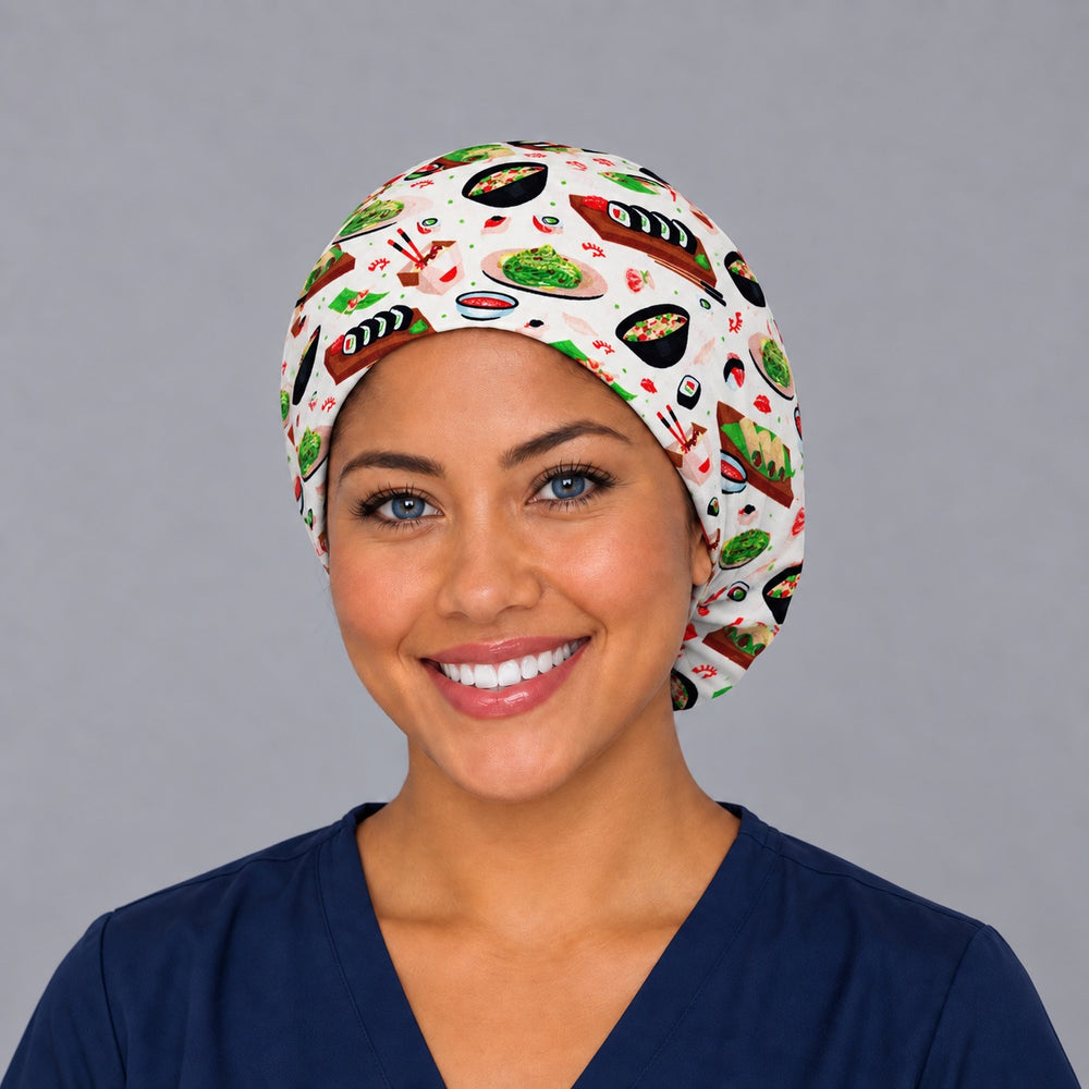 Woman wearing a Sushi Night Euro scrub cap, front view — maki rolls and ramen bowls on cream, adjustable surgical hat for nurses