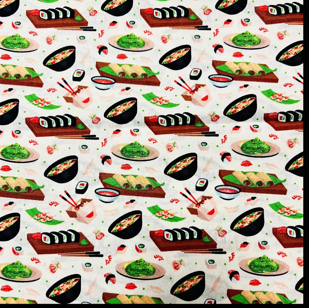 Fabric detail of the Sushi Night scrub cap — close-up of maki rolls, ramen bowls and edamame on cream cotton