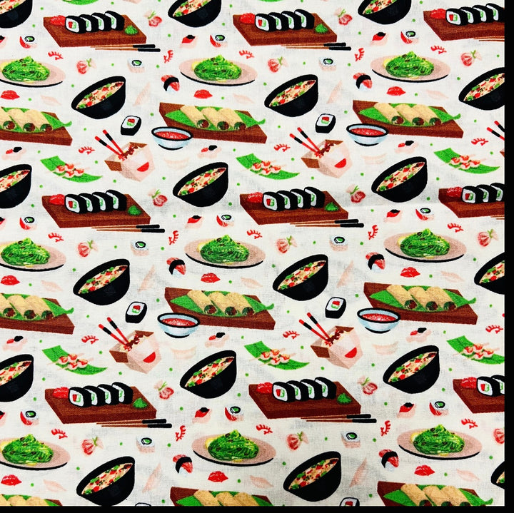 Fabric detail of the Sushi Night scrub cap — close-up of maki rolls, ramen bowls and edamame on cream cotton
