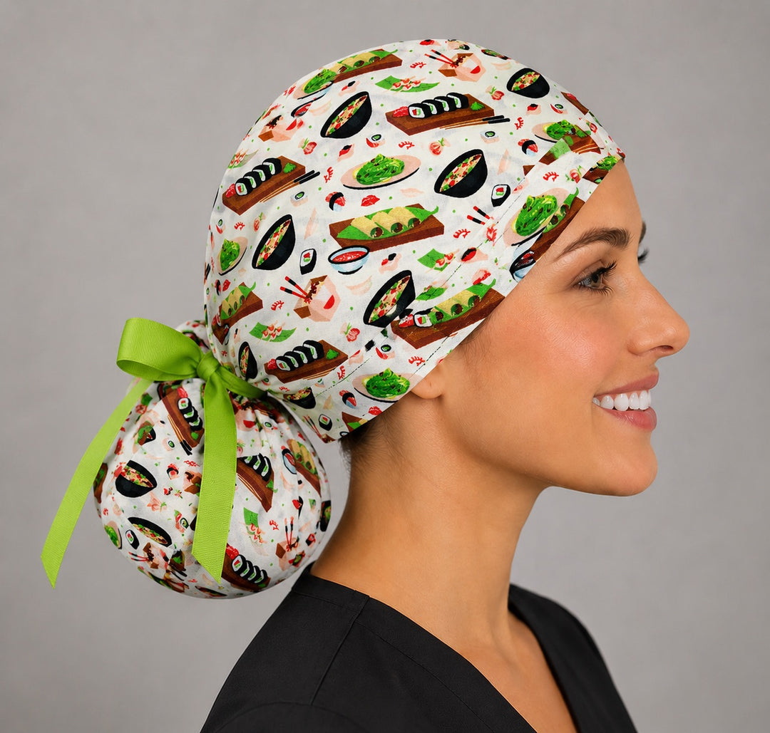 Sushi ponytail scrub cap right side profile with full ponytail pouch of sushi, edamame and dumplings and long lime green ribbon ties