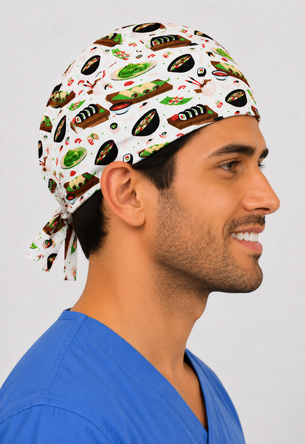 Back view of sushi tie-back scrub cap showing bow tie closure — handmade-in-USA OR World men's Japanese food-print surgical hat.