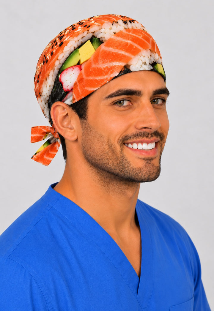 Smiling male surgeon in a photorealistic sushi tie-back scrub cap with salmon nigiri and California roll print