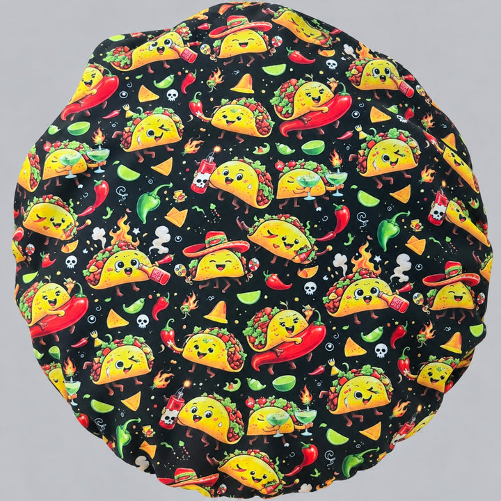 Back view of the taco bouffant scrub cap — full gathered crown showing sombrero tacos, limes and tortilla chips on black