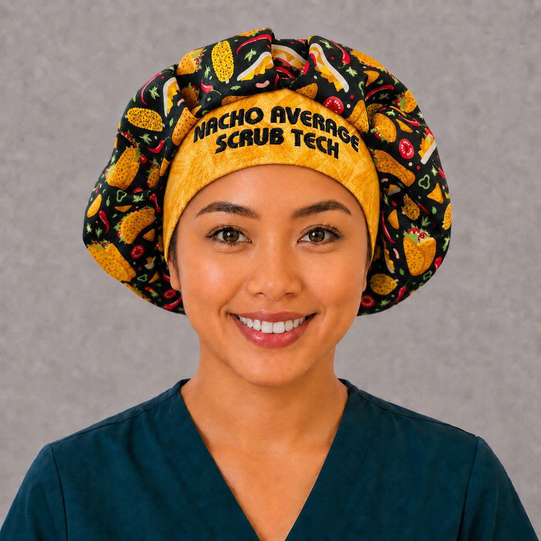 Side profile of the taco fiesta bouffant surgical hat — golden batik embroidered band with chili and corn print, roomy breathable cotton cap