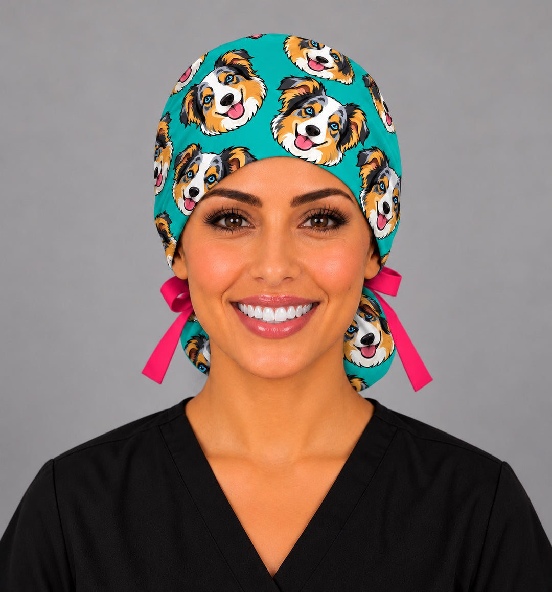 Front view of a teal cartoon dog ponytail scrub cap with custom pet faces, a personalized gift for OR nurses and anesthesia