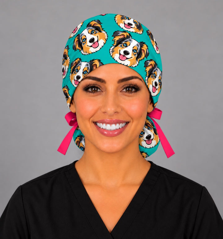 Front view of a teal cartoon dog ponytail scrub cap with custom pet faces, a personalized gift for OR nurses and anesthesia