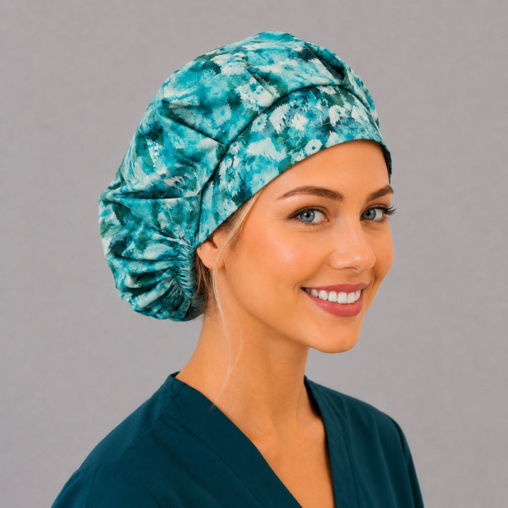 Teal geometric bouffant cap for women, right angled smiling view — handmade winter icicle surgical cap, USA made