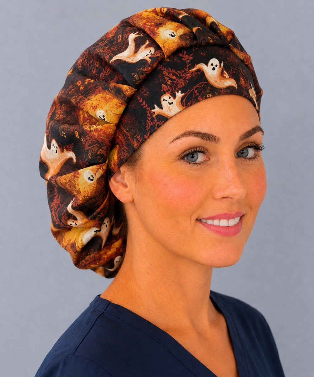 Thanksgiving and Halloween ghost bouffant surgical cap for long hair, side view — amber and black autumn print, breathable cotton