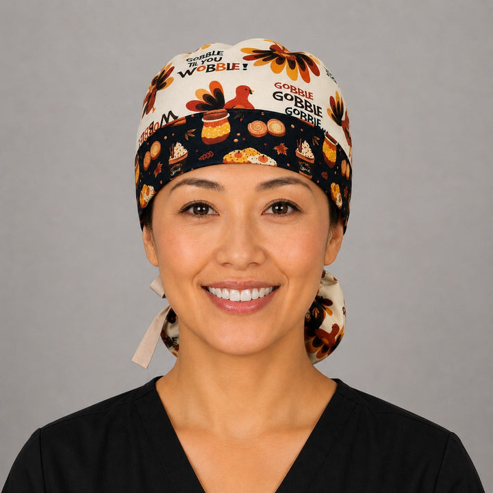 Thanksgiving turkey ponytail scrub cap back view close-up showing gathered pouch full of turkeys and Gobble Til You Wobble text on cream with peach ribbon bow