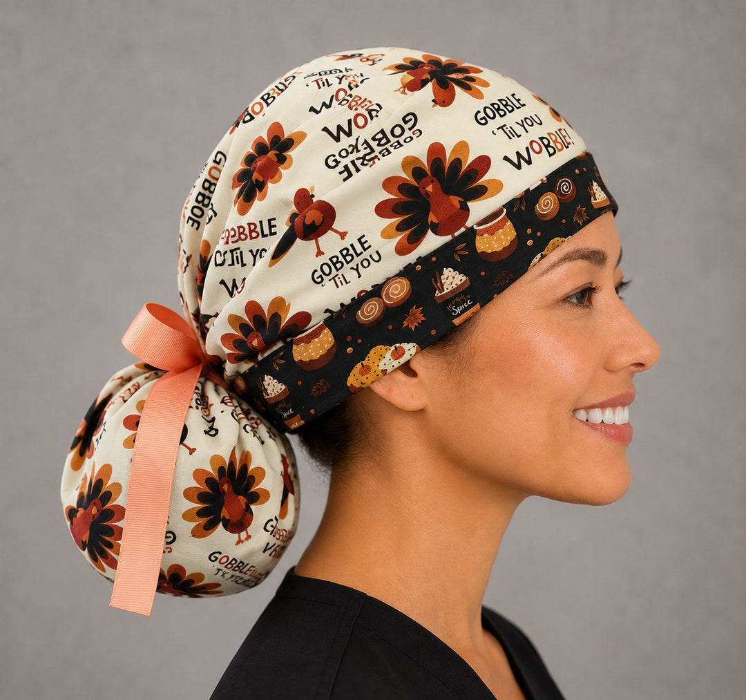 Thanksgiving turkey ponytail scrub cap right side profile with full ponytail pouch of turkeys and Gobble Til You Wobble text and long peach ribbon ties