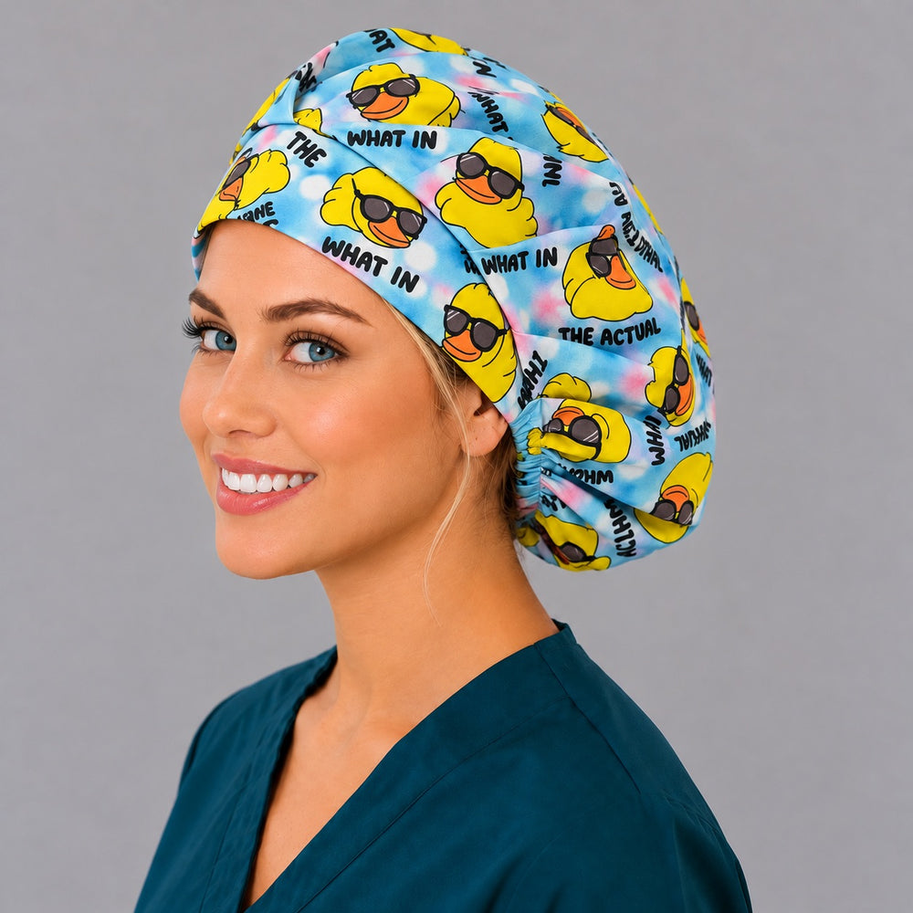Right three-quarter view of a blue tie-dye duck nurse bouffant, with pleated folds across the crown and a smiling glance to camera