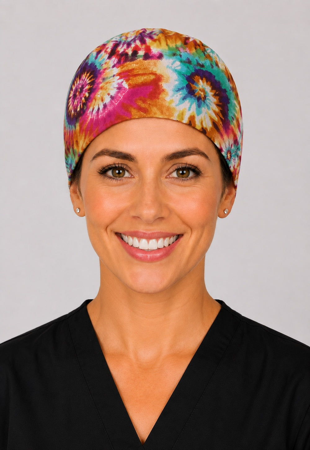 Rainbow tie dye scrub cap for short hair, handmade women's tie-back surgical hat on OR nurse, front view