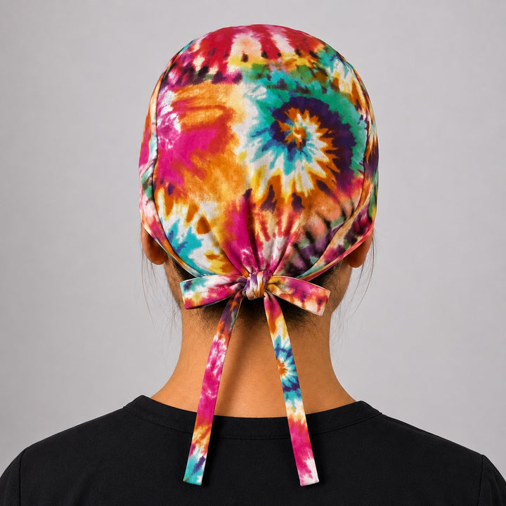 Back view of adjustable tie-back knot on rainbow tie dye scrub cap for short hair