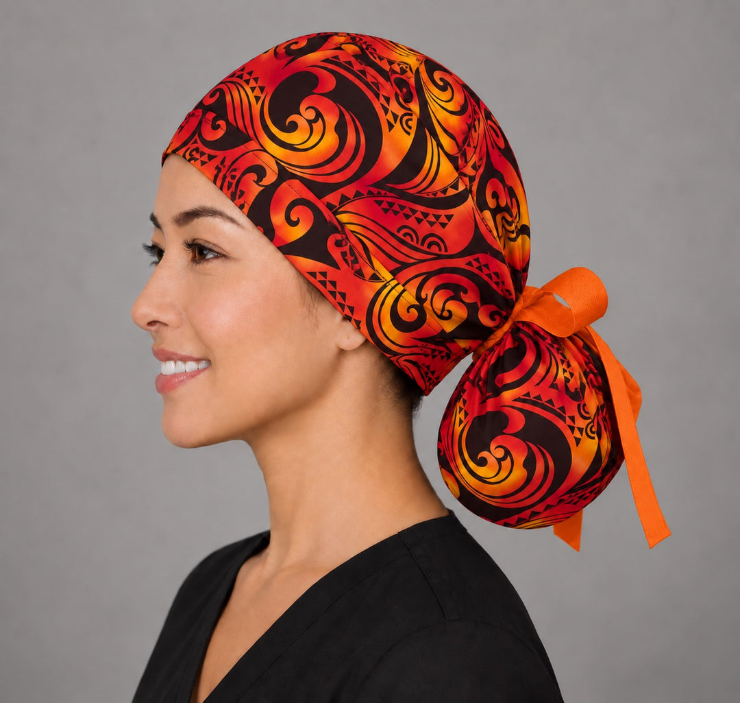 Tribal Fire ponytail cap, right angled smiling view — flame swirl print for OR nurses and surgical techs
