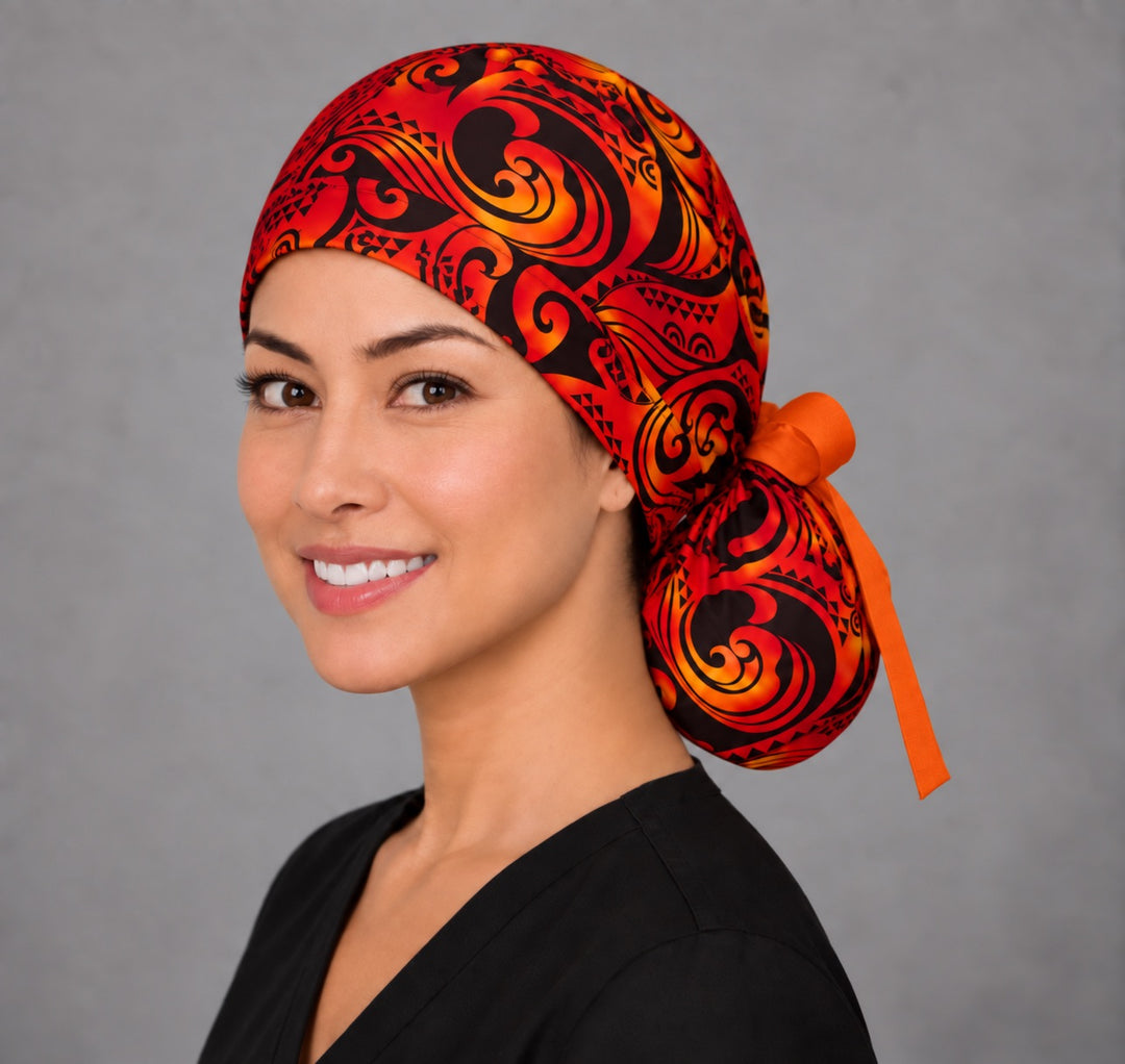 Tribal Flame ponytail scrub cap, left angled view — open back ribbon-tie style that fits a ponytail or bun