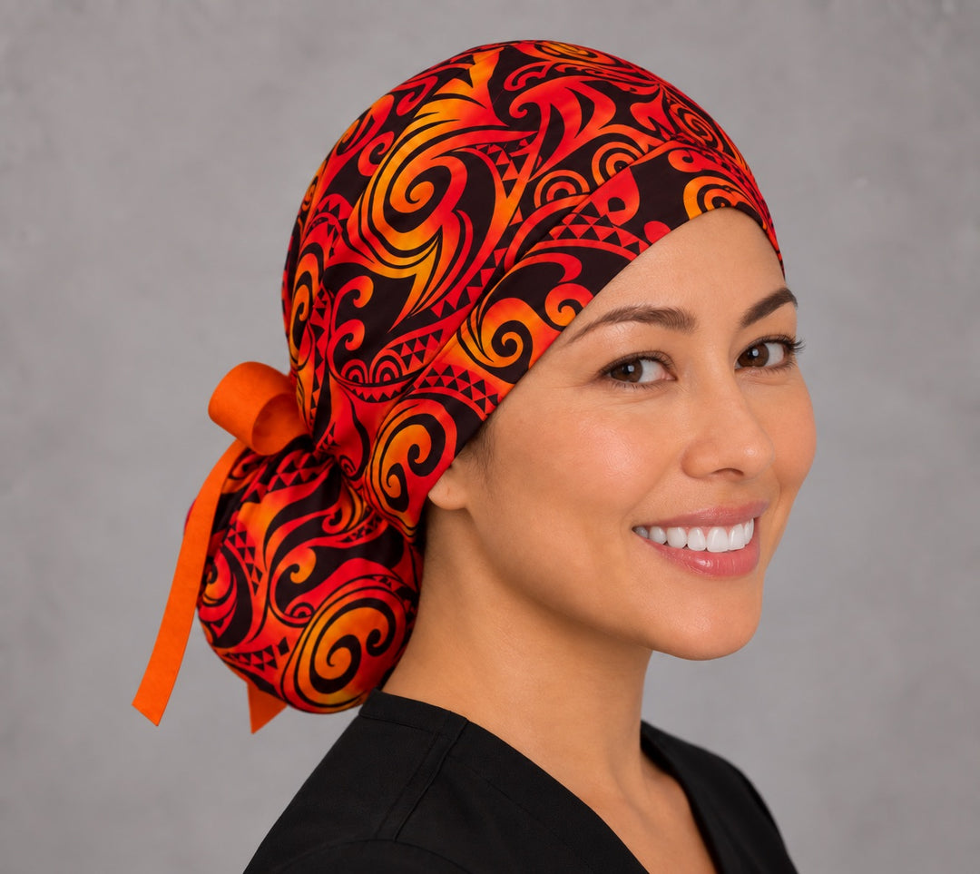 Tribal Flame ponytail scrub cap, right side profile — gathered ponytail pouf with orange ribbon tie