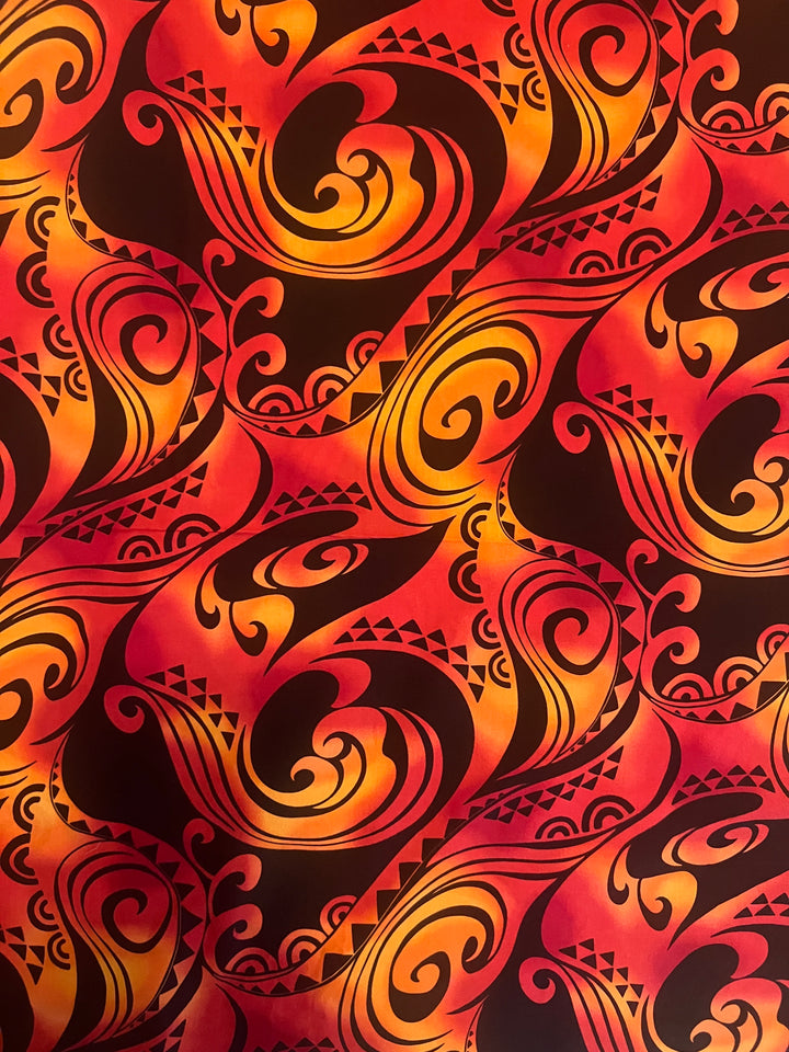 Fabric detail of the Tribal Flame scrub cap — close-up of red, orange and black Polynesian flame print