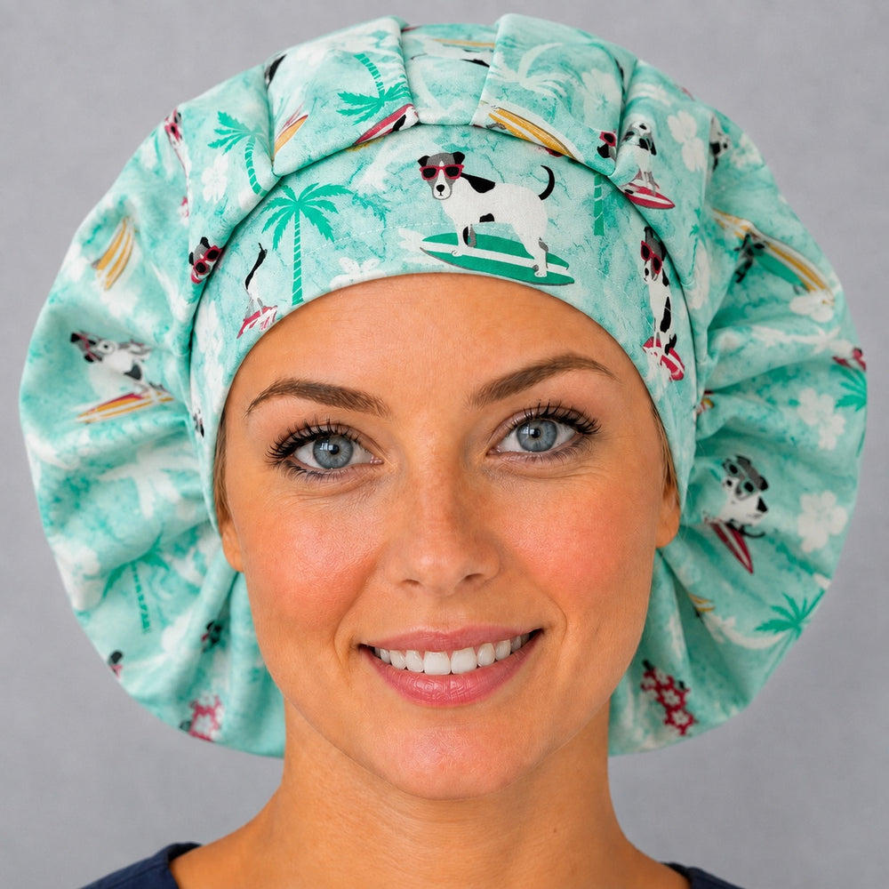 Tropical beach dog bouffant cap for women, angled smiling view — handmade mint surf dog print surgical cap, USA made