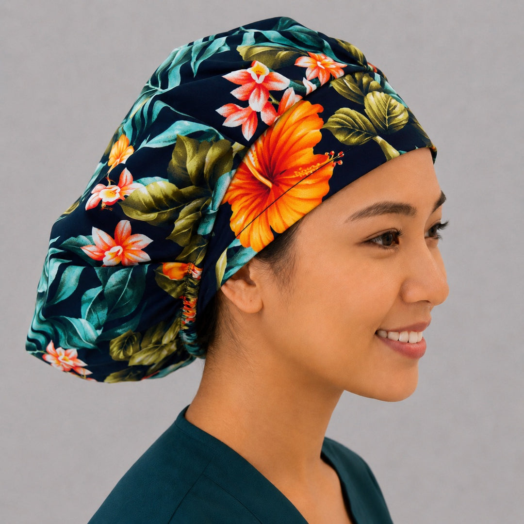 Tropical floral bouffant surgical cap right side profile showing orange hibiscus and monstera leaves on black, OR World tropical nurse hat