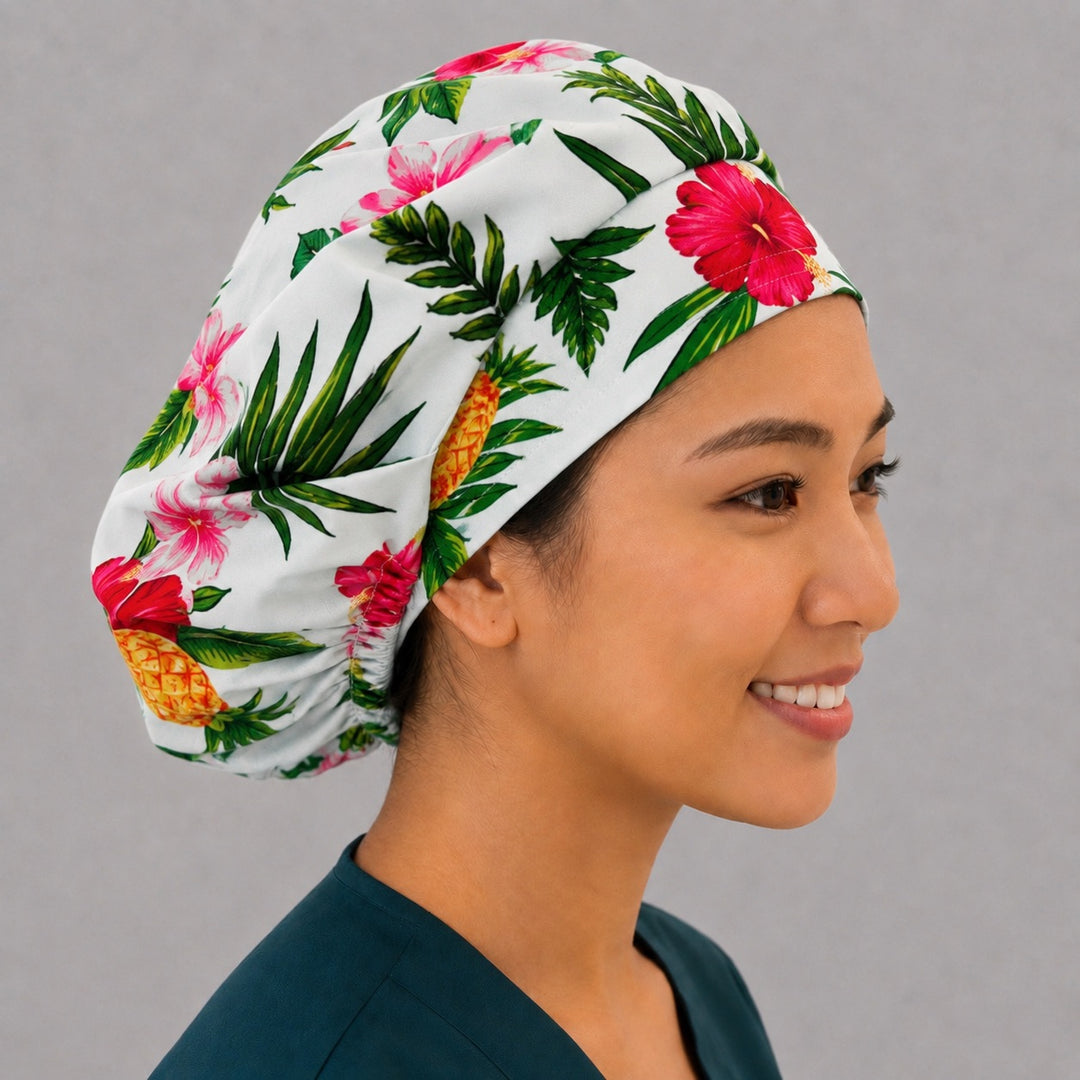 Right side profile of the tropical hibiscus and pineapple bouffant surgical hat — palm leaf print, roomy breathable cotton cap for nurses