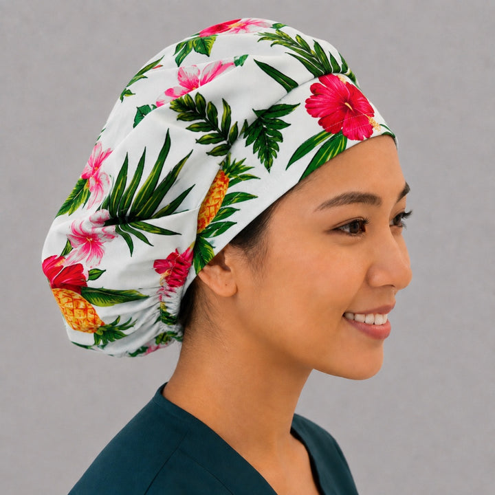 Right side profile of the tropical hibiscus and pineapple bouffant surgical hat — palm leaf print, roomy breathable cotton cap for nurses