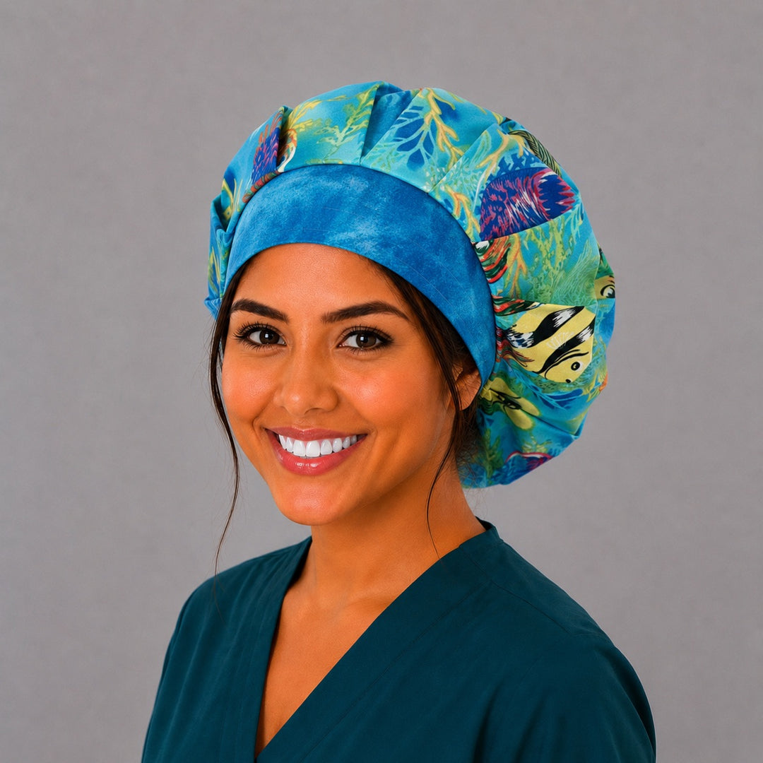 Back view of the tropical ocean bouffant scrub cap — full roomy fit showing sea turtle, angelfish and coral reef print on turquoise