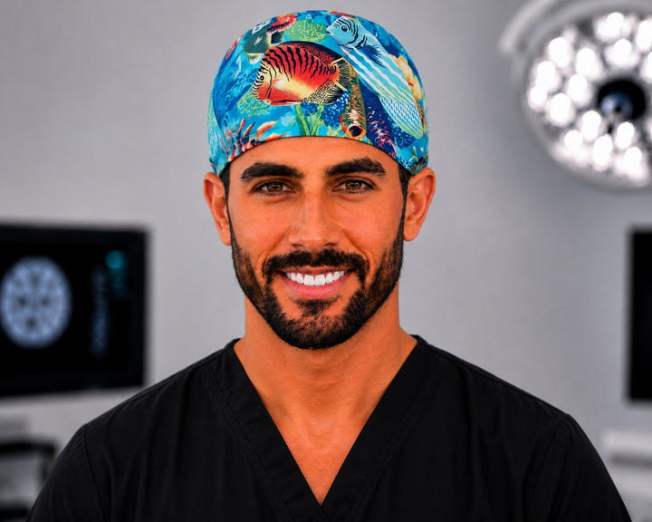 Man in tropical ocean reef fish scrub cap, unisex colorful aquarium fish surgical hat, straight front view